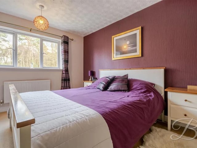 Spacious master bedroom featuring fitted carpet and built-in wardrobes providing ample storage.