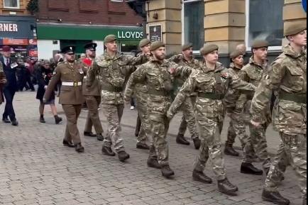 The parade marches through the Market Square