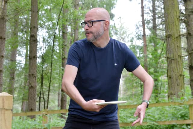 Chad editor Ashley Booker playing disc golf at Sherwood Pines.
