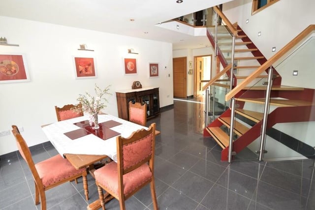 Within the dining room is a dramatic, contemporary feature staircase that leads up to the first floor of the property.