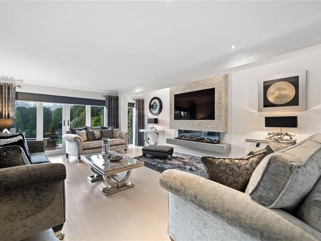 This stunning lounge is the perfect place to spend cosy nights. The room features patio doors leading to rear aspect and double glazed windows with two feature velux windows and feature media wall with contemporary electric fire inset, tiled flooring and radiator.