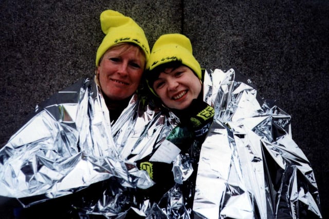 Rossington's Kim Blythe and Sheffield's Dawn Peters both of the Management team at Crystal Peaks Shopping Centre in space blankets after completing a gruelling 26.2 miles walk marathon in aid of Breakthrough Breast Cancer  in 1999 raising £2001 for the cause