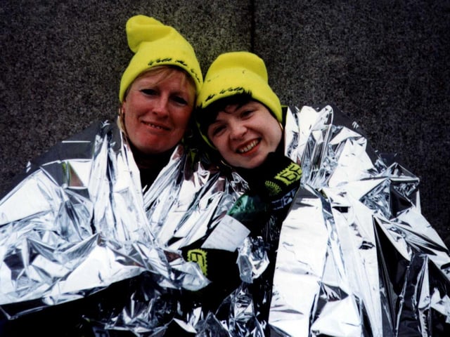 Rossington's Kim Blythe and Sheffield's Dawn Peters both of the Management team at Crystal Peaks Shopping Centre in space blankets after completing a gruelling 26.2 miles walk marathon in aid of Breakthrough Breast Cancer in 1999 raising £2001 for the cause