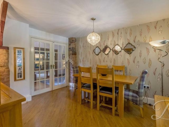 Attached to the kitchen is this good-sized dining room, which is the perfect spot for family meals or for entertaining friends.