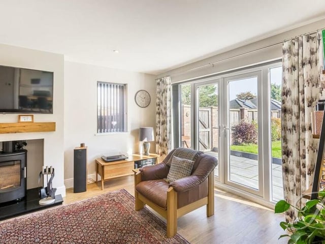 Other features of the first reception room include French doors, which lead out to the garden, laminate flooring and inset spotlights to the ceiling.