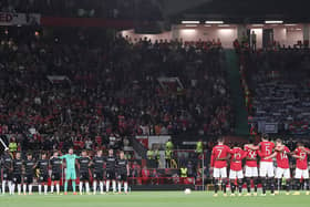 The teams take part in a minute's silence to mark the passing of Queen Elizabeth II ahead of the UEFA Europa League group E match between Manchester United and Real Sociedad at Old Trafford.