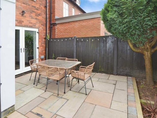 An enticing feature of the rear garden is this secluded patio area with space for seating. The bi-folding doors lead from the snug.