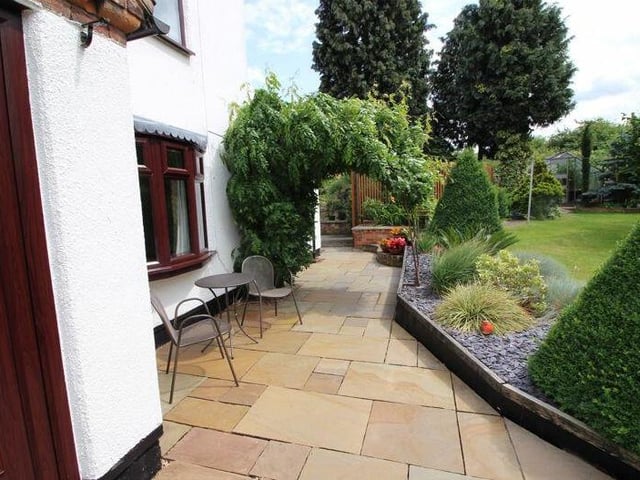 The front garden is beautifully manicured. Take a seat and admire.