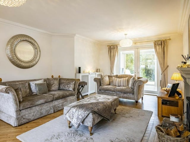 Doors from the orangery lead into the living room, which exudes warmth and comfort.