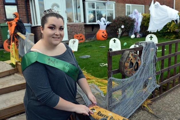 Eleanor Pheasant in front of her house which is all decorated ready for Halloween