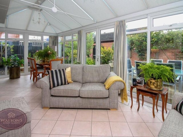 The conservatory is constructed with an apex roof, fitted with integrated blinds. There are light and power points, plus a vinyl floor.