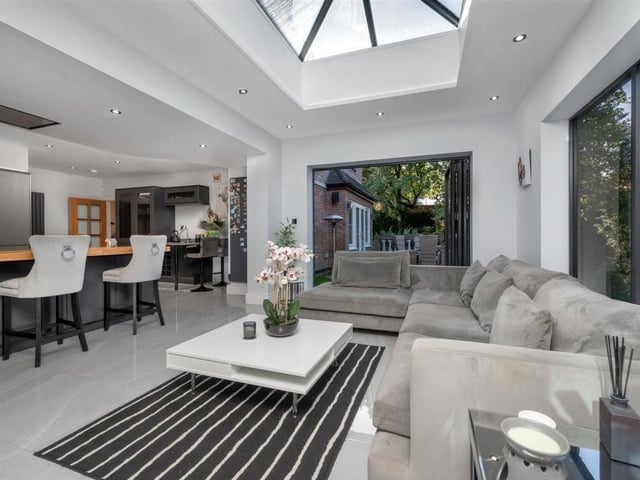 The kitchen's open-plan living area boasts an orangery roof lantern and several ceiling spotlights, not to mention floor-to-ceiling windows.Two sets of bi-fold doors lead to balconies.