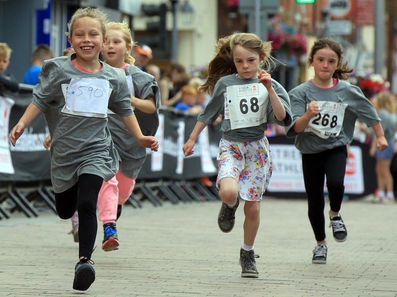 The young runners are pictured enjoying their experience. Do you know who these kids are?