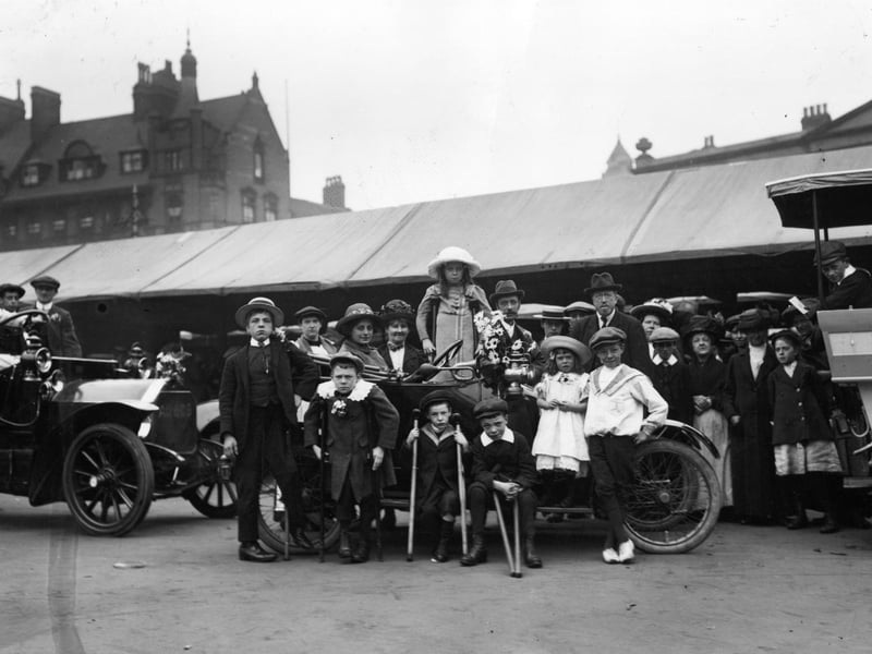 A group of crippled children prepare for a drive to Welbeck Abbey in July 1913.