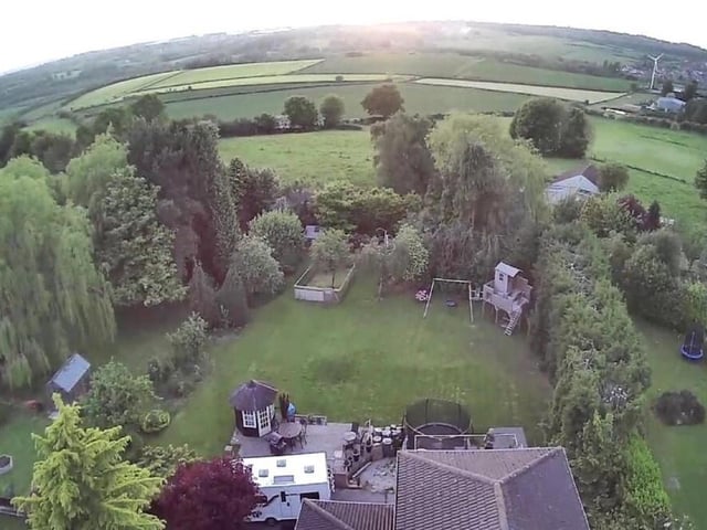 We close our photo gallery with this bird's eye view, showing the rear of the £960,000 property and the breathtaking scenery beyond.