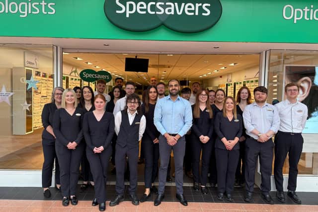 The current team outside the store are gearing up for their anniversary celebrations