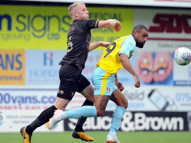 Neal Bishop battles in a 2018 friendly game.