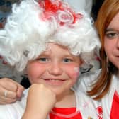 Scott Burt, aged 11, and his sister, 14 year old Jessica, get ready to cheer on England.