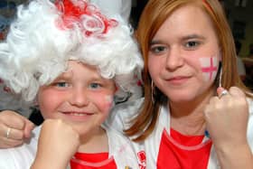 Scott Burt, aged 11, and his sister, 14 year old Jessica, get ready to cheer on England.