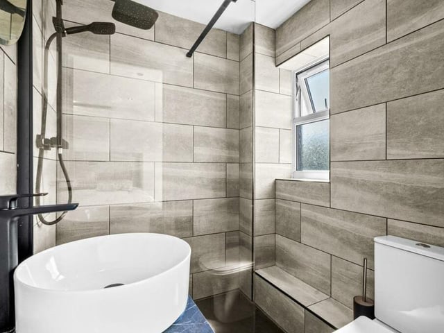 More bathroom excellence on the first floor, including a modern walk-in shower enclosure.