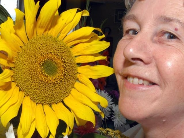 Farnsfield Horticultural Club member Jenny Frost, with her sunflower at their summer show.