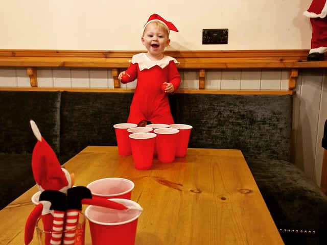 Bubbles the Elf enjoying a quick game down the pub