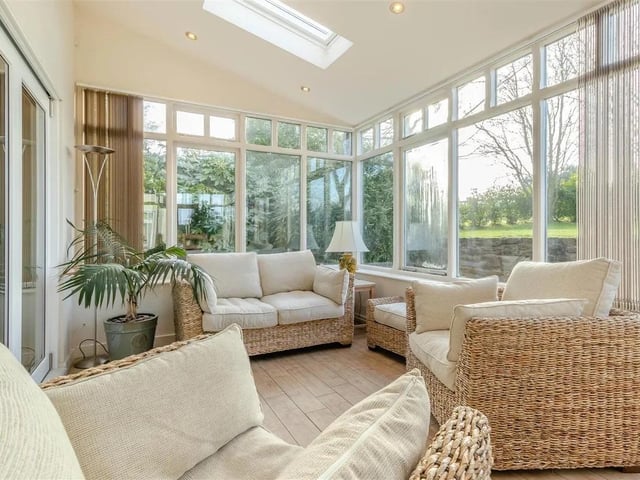A south facing, living/dining space enjoying 10ft ceiling height. With tiled floor, radiator, ample ceiling spotlights, four electric velux roof windows, and two separate timber double glazed doors providing access out onto the substantial terrace garden.