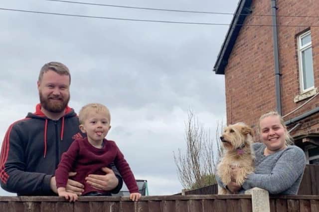 Scott Austin pictured with his son Freddie, partner Natalie and dog Ruby.