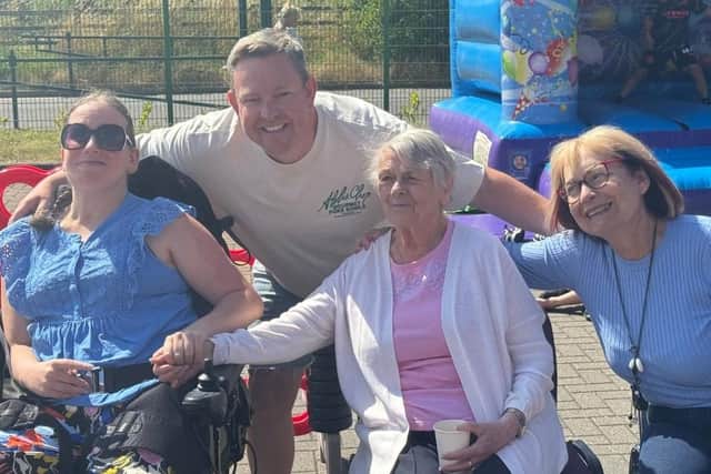 Smiles all round at the Your Home Care barbecue.