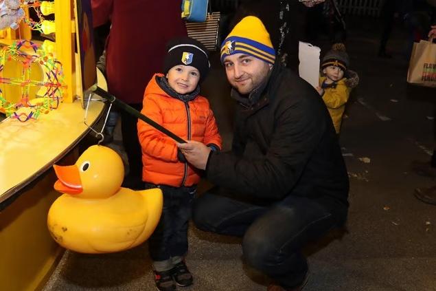 Jonny Wood and his son Oscar enjoy some classic fairground fun as they try their luck at the hook-a-duck stall back in 2017
