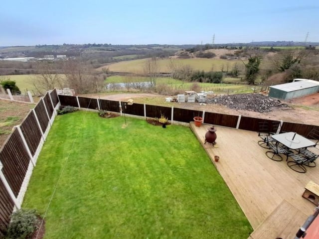 Our final photo of the near-£500,000 property on Main Road, Kirkby shows the enclosed back garden, featuring a lawn and a decked patio area that could be ideal for entertaining on a warm summer evening.