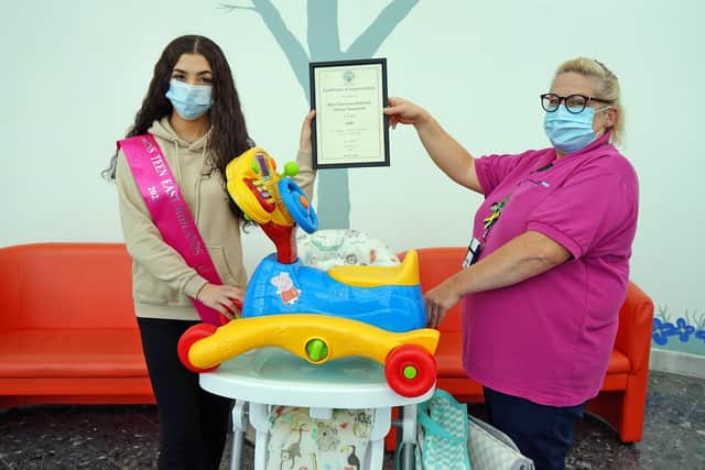 Sienna is pictured alongside Julia Smith from ward 25, a play specialist, at King's Mill Hospital.