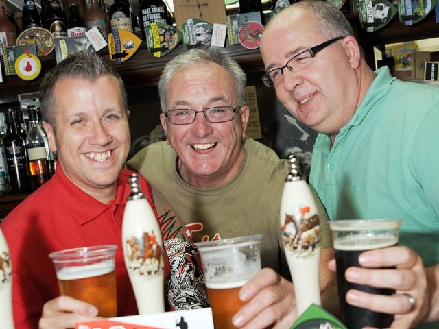 Chris Vann, Pete Dring and Carl Proctor try a brew at the beer festival held at the Priors Well Brewery in Mansfield Woodhouse in 2017.