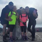 Sophie and Jessica alongside their mum and dad during the Three Peaks Challenge