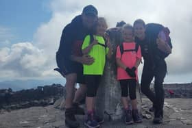 Sophie and Jessica alongside their mum and dad during the Three Peaks Challenge