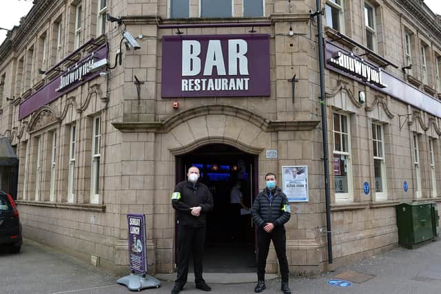 Door staff outside Andwhynot ready to welcome customers back.