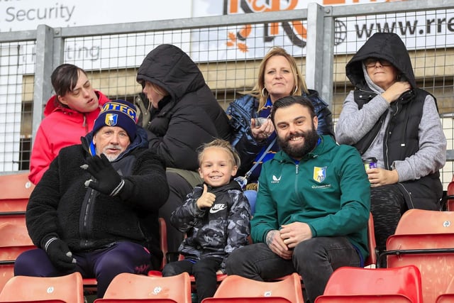 Mansfield Town fans watch the defeat at Wrexham.