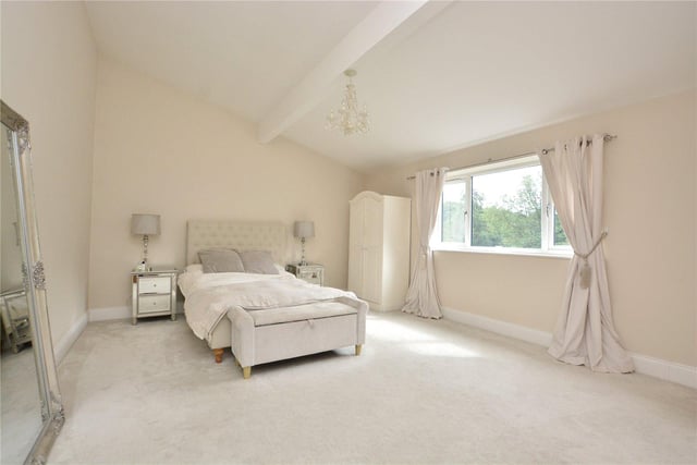 There are four bedrooms throughout the property, including this stylish master room which benefits from its own en-suite.