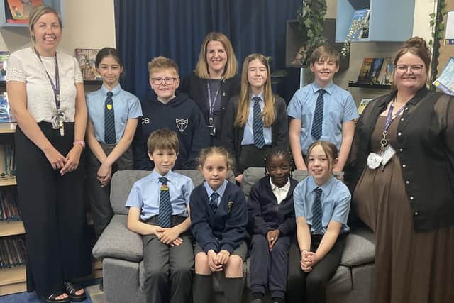 Photograph adults left to right: Mrs Rebecca Turvey (Assistant Headteacher), Mrs Sarah Pearson (Headteacher), and Miss Emily Cave (Assistant Headteacher), with children of St Mary Magdalene C of E Primary School.