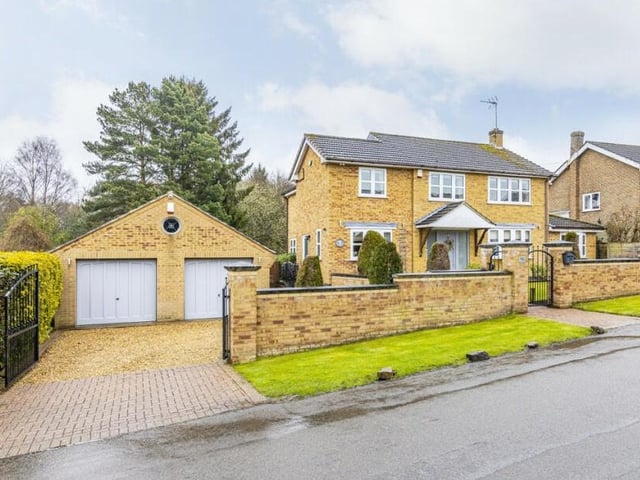 For the last photo in our gallery, let's return to the front of the house, where the well-maintained garden features a large double garage. It can be put to multiple uses and even has planning permission to be converted into a separate dwelling if you wish to activate that.