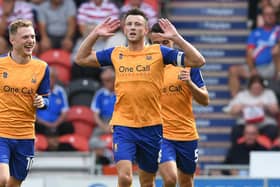 Ollie Clarke celebrates his goal at Doncaster earlier this month.
