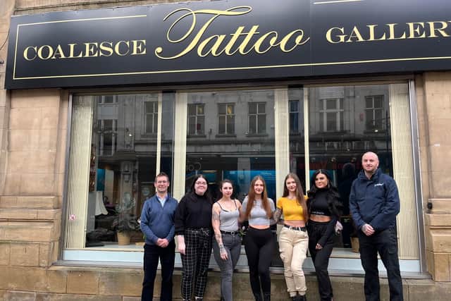 Executive Mayor Andy Abrahams with the team at Coalesce Tattoo Gallery