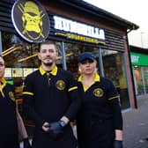 Staff outside Hungrilla Gourmet Grill restaurant in Mansfield Woodhouse.