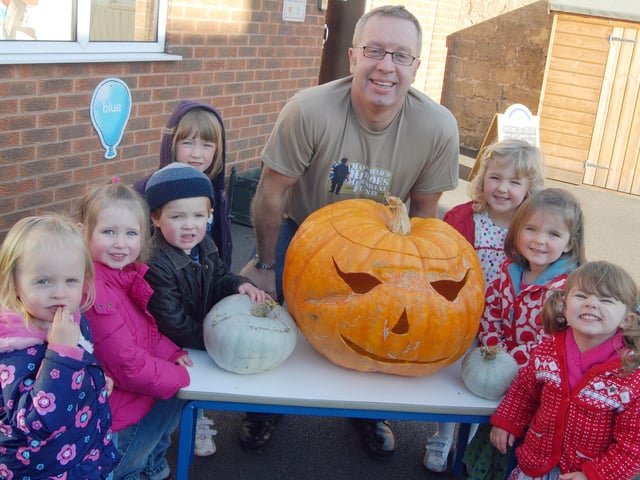 Youngsters who attend the Bright Sparks Nursery on Derby Road, meet up with their giant Halloween, pumpkin donated and carved for them by Graham Parker, who gave it to them in thanks for their fund raising efforts via a bake sale in aid of the Mansfield Heroes fund.