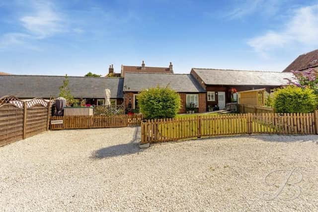 Offers in the region of £475,000 are being invited by estate agents BuckleyBrown for this three-bedroom grade II listed barn conversion on Sookholme Road at Sookholme in Mansfield.