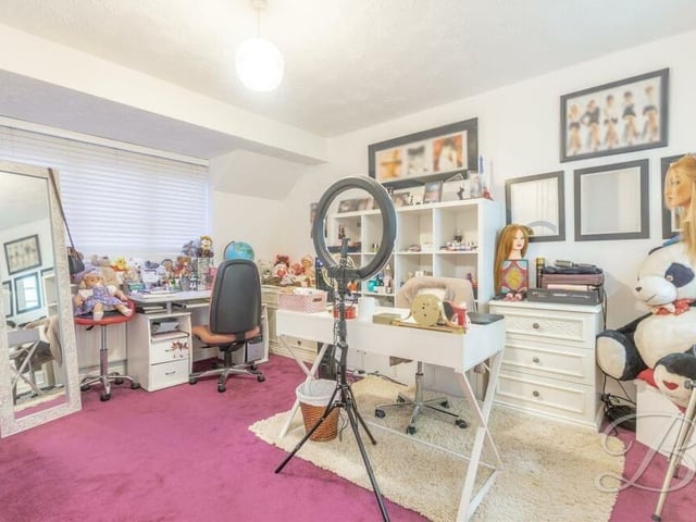 This second bedroom is currently being utilised as a working area, but is spacious with fitted carpets, fitted wardrobes and a window facing the front of the property.