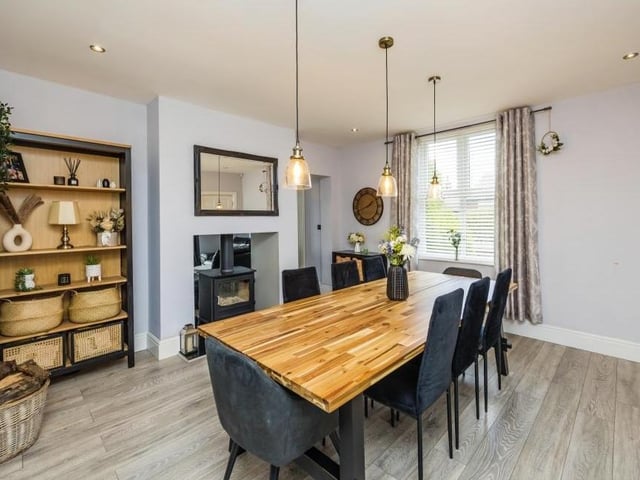 A second look at the dining room, complete with feature fireplace and log-burner.