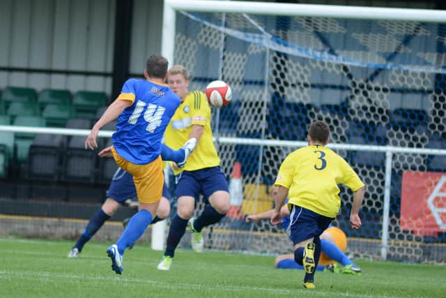 Louis Briscoe has a shot at goal during Mansfield's FA Trophy win at Worksop. PIc by Chris Etchells