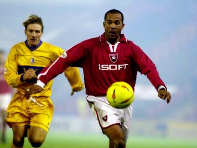 Dean Gorre escapes from Liam Lawrence at Oakwell.