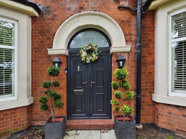 How about this arched, character-laden front door for a welcoming entrance?